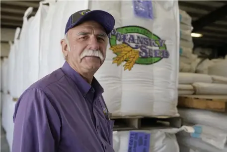  ?? Ap ?? ‘WRONG DIRECTION’: Adrian Polansky, a farmer and former executive director of the USDA’s Farm Service Agency office in Kansas during the Obama administra­tion, stops for a photo while touring his seed processing plant near Belleville, Kan., on Friday.