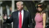  ?? THE ASSOCIATED PRESS ?? President Trump stops to speak to members of the media with first lady Melania Trump at Episcopal Church of Bethesda-bythe-Sea.