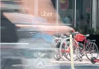  ?? SARAHBETH MANEY THE NEW YORK TIMES FILE PHOTO ?? Uber believes its drivers will retain their independen­t status when the California measure goes into effect on Jan. 1.