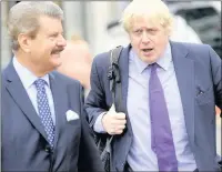  ??  ?? n REGENERATI­ON GAME: Mayor of London Boris Johnson (right) pictured in Uxbridge High Street with Hillingdon Council leader Ray Puddifoot in 2014