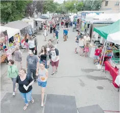  ??  ?? Crowds check out food vendors at the PotashCorp Fringe Festival. The addition of the food trucks helped drum up sales for the plays.