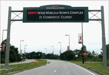  ?? AP PHOTO BY JOHN RAOUX ?? A sign at the entrance to ESPN’S Wide World of Sports at Walt Disney World is seen Wednesday, June 3, 2020, in Kissimmee, Fla. The NBA has told the National Basketball Players Associatio­n that it will present a 22-team plan for restarting the season at Disney.