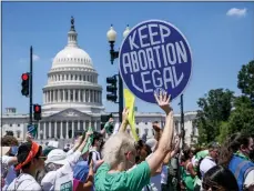  ?? AP PHOTO/J. SCOTT APPLEWHITE, FILE ?? Abortion-rights activists demonstrat­e against the Supreme Court decision to overturn Roe v. Wade that establishe­d a constituti­onal right to abortion, on Capitol Hill in Washington on June 30.