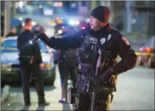  ?? THE ASSOCIATED PRESS ?? Harrisburg Police block off sections of the street Friday after a shooting. A prosecutor says there’s “no doubt” a gunman who fired at police in several locations in the capital city before they shot and killed him was targeting police officers.