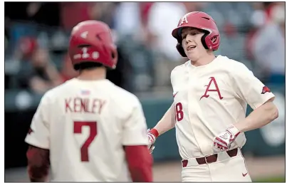  ?? NWA Democrat-Gazette/ANDY SHUPE ?? Arkansas sophomore right fielder Heston Kjerstad crosses home plate after hitting a home run in the third inning of the No. 7 Razorbacks’ victory over Northweste­rn (La.) State on Tuesday night at Baum-Walker Stadium in Fayettevil­le.