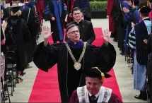  ?? PHOTO BY DON FERIA ?? The Rev. Kevin O’Brien gestures after being robed during his installati­on ceremony as the 29th president of Santa Clara University. O’Brien succeeds Michael Engh, who served from 2009 to 2019.