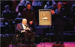  ??  ?? From left, artist and Country Music Hall of Fame inductee Fred Foster is inducted into the Country Music Hall of Fame by artist Vince Gill and Country Music Hall of Fame Director Kyle Young at the Country Music Hall of Fame Medallion Ceremony.