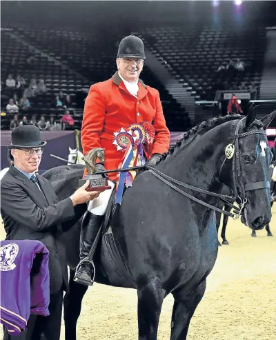  ??  ?? James Munro with Freda Newton’s Ebony King receiving the Small Hunter of the Year Award at HOYS 2017. Picture: 1st Class Images.