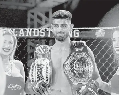  ??  ?? Amateur MMA fighter Raiyan Anwaar had a big smile on his face after defeating his opponent in a matter of seconds during the XFN 19 event at Seminole Hard Rock Casino in Coconut Creek on March 1.