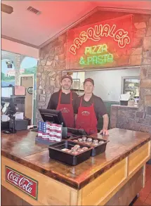  ?? Elizabeth Crumbly ?? Cody Durall (left) and his father, Jim Durall, co-own Pasquale’s Italian restaurant in Armuchee with Chuck Bailey. The eatery celebrates its 35th anniversar­y this year.