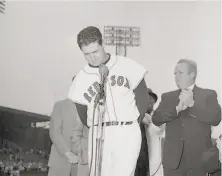  ?? Associated Press 1960 ?? Ted Williams says goodbye to fans in Boston. John Updike’s famed game story is online; Google “Hub Fans Bid Kid Adieu.”