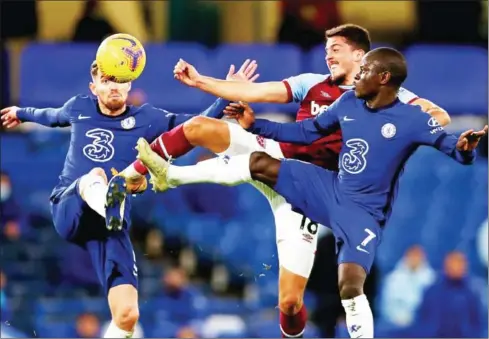  ?? POOL/AFP ?? West Ham United midfielder Pablo Fornals (centre) vies with Chelsea midfielder Jorginho (left) and N’Golo Kante during the English Premier League football match between Chelsea and West Ham United at Stamford Bridge in London on December 21.