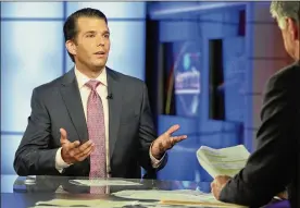  ?? RICHARD DREW / AP ?? Donald Trump Jr. (left) is interviewe­d Tuesday by Sean Hannity on Fox News. Trump Jr. accepted help from what was described to him as a Russian government effort to aid his father’s campaign, according to emails he released Tuesday.