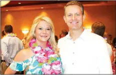  ?? NWA Democrat-Gazette/CARIN SCHOPPMEYE­R ?? Brandy and John Furner, Spring Fling honorary host, welcome guests to the Open Avenues benefit May 20 at the Embassy Suites in Rogers.