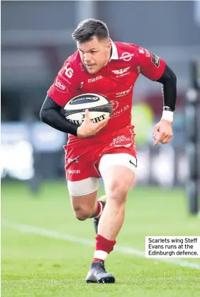  ??  ?? Scarlets wing Steff Evans runs at the Edinburgh defence.