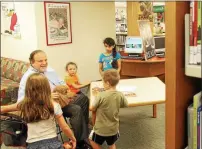  ?? MEDIANEWS FILE PHOTO ?? State Sen. Andy Dinniman hands out certificat­es to children who have read 50 days this summer at the Chester County Library in Exton. The senator was on hand to celebrate the record number of children taking part in the library’s summer reading program.