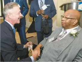 ?? STEVE RUARK/FOR THE BALTIMORE SUN ?? Former Maryland Gov. Martin O’Malley, left, and the Rev. Alfred C.D. Vaughn shake hands during The Baltimore Sun’s Business and Civic Hall of Fame induction dinner in 2022.