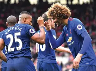  ?? REUTERS/ANTHONY DEVLIN ?? SENANG: Bek kanan Manchester United Antonio Valencia merayakan gol ketiga ke gawang Middlesbro­ugh bersama rekannya, Marouane Fellaini, di Riverside Stadium tadi malam WIB.