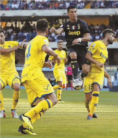  ?? AP PHOTO ?? FLYING START: Cristiano Ronaldo jumps as he reaches for the ball during his debut match with Italy’s Juventus yesterday. Ronaldo didn’t score, but his side beat Chievo Verona in Serie A action.