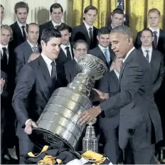  ?? THE ASSOCIATED PRESS FILES ?? Then-U.S. President Barack Obama and Pittsburgh Penguins captain Sidney Crosby set down the Stanley Cup in the White House on Oct. 6, 2016, when the president honored the 2016 Stanley Cup champion Pittsburgh Penguins.