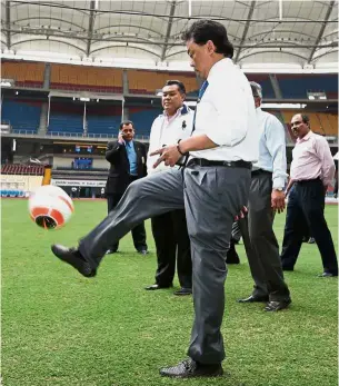  ??  ?? On the ball: Tengku Abdullah checking the turf at the National Stadium in Bukit Jalil before the Malaysia Cup final in October 2014. — GLENN GUAN/ The Star