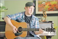  ?? ELIZABETH PATTERSON/CAPE BRETON POST ?? As Stephen MacDougall practises on a guitar he borrowed from his mother, he wonders where his own instrument­s are and why anyone would take them.