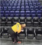  ?? ANDY LYONS/GETTY IMAGES ?? Many arenas across the country will have empty seats for basketball games as a precaution against the coronaviru­s.