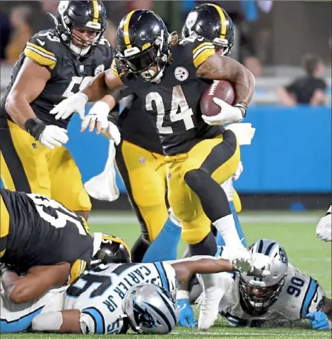  ?? Matt Freed/Post-Gazette ?? Steelers running back Benny Snell Jr. carries against the Panthers in the second quarter Friday night at Bank of America Stadium in Charlotte, N.C.