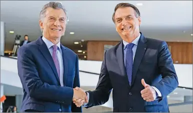  ?? DPA ?? ¿ALIADOS? Bolsonaro pidió el voto para Macri pero su reforma jubilatori­a mete presión al Gobierno.