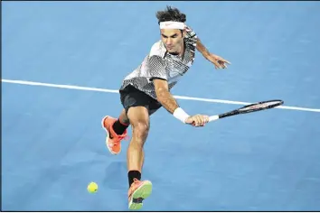  ?? PAT SCALA / GETTY IMAGES ?? Roger Federer, sidelined by a knee injury for much of 2016, backhands a shot during his 7-5, 6-3, 1-6, 4-6, 6-3 victory over Stan Wawrinka in the semifinals.