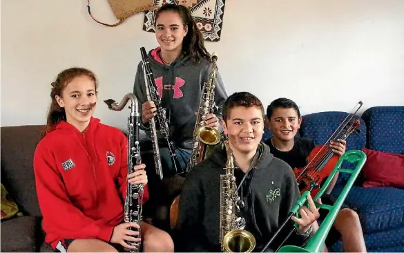  ??  ?? From left: Papakura Music School members Jasmine, Jesse, Isaac and Sam Fuemana.