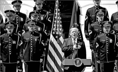  ?? EVAN VUCCI/ASSOCIATED PRESS ?? President Donald Trump sings the national anthem at the White House on Tuesday in lieu of an appearance by the Super Bowl champ Philadelph­ia Eagles.