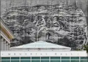  ?? HYOSUB SHIN/HYOSUB.SHIN@AJC.COM ?? Memorial Hall (foreground) and the massive Confederat­e memorial carving at Stone Mountain Park are targeted by those opposing their glorificat­ion of the Confederac­y.