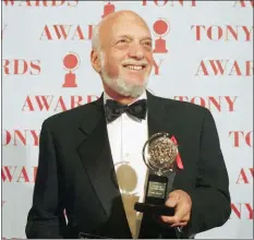  ?? RICHARD DREW — THE ASSOCIATED PRESS FILE ?? In this file photo, Harold Prince holds his Tony award for best director in a musical for “Show Boat,” at Broadway’s Minskoff Theater in New York. Prince, who pushed the boundaries of musical theater with such groundbrea­king shows as “The Phantom of the Oepra,” “Cabaret,” “Company” and “Sweeney Todd” and won a staggering 21 Tony Awards, died Wednesday after a brief illness in Reykjavik, Iceland. He was 91.