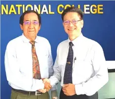  ??  ?? FIC chief executive officer Dr Peter Tham (left) welcomes experience­d educationi­st Wong King Kui, who joins the college as its education consultant.