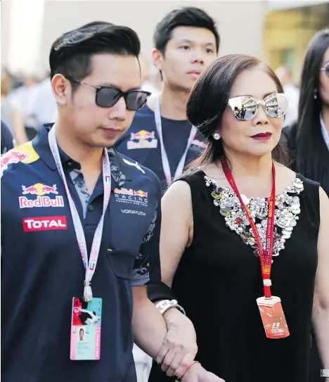  ?? XPB IMAGES VIA AP ?? Red Bull heir Vorayuth “Boss” Yoovidhya with his mother Daranee at the Abu Dhabi F1 Grand Prix in November. Vorayuth is accused of killing a Thai police officer in a hit-and-run in 2012 but has not appeared to face charges.