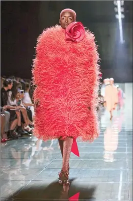  ?? The Associated Press ?? This Sept. 12 file photo shows a model wearing a coral outfit from the Marc Jacobs spring 2019 collection during Fashion Week in New York. Pantone Color Institute has chosen the color Living Coral as its 2019 color of the year.