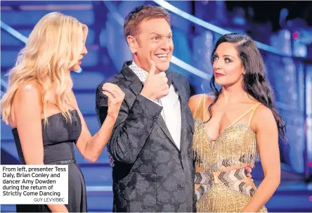  ?? GUY LEVY/BBC ?? From left, presenter Tess Daly, Brian Conley and dancer Amy Dowden during the return of Strictly Come Dancing