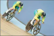  ?? ?? Matthew Glaetzer (right), of Australia leads compatriot Thomas Cornish in their men’s sprint during the Commonweal­th Games track cycling at Lee Valley VeloPark in London. (AP)