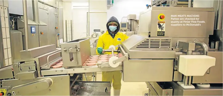  ??  ?? MAN MEATS MACHINE: Patties are checked for quality at Finlar Fine Foods, suppliers to McDonald’s