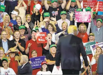  ?? Nati Harnik Associated Press ?? THE AUDIENCE at a rally with President Trump in Iowa reacts Tuesday. He again placed Sen. Dianne Feinstein among the segment of her party that says she doesn’t belong with them — the more liberal wing.