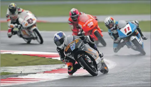  ?? Photo: Bonnie Lane ?? ACTION MAN: John McPhhe in action on the rain-soaked track at Silverston­e