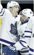  ?? MARK ZALESKI/THE ASSOCIATED PRESS ?? Toronto Maple Leafs left wing James van Riemsdyk, left, celebrates with centre Nazem Kadri (43) after scoring a goal against the Predators Thursday, in Nashville.