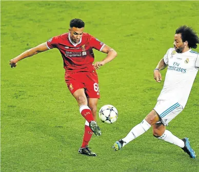  ?? Picture: GETTY IMAGES ?? OFF TO RUSSIA: Liverpool’s Trent Alexander-Arnold, left, is challenged by Marcelo of Real Madrid during the Uefa Champions League final in Kiev, Ukraine. Alexander-Arnold will represent England in the World Cup