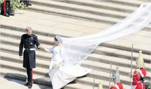  ?? PHOTO: REUTERS ?? Britain’s Prince Harry, Duke of Sussex and his wife Meghan, Duchess of Sussex leave from the St George’s Chapel, Windsor Castle, after their wedding.