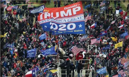  ?? ?? Donald Trump supporters take over stands set up for the presidenti­al inaugurati­on on 6 January. Photograph: Olivier Douliery/AFP/Getty Images