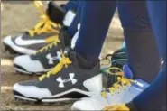  ?? BARRY TAGLIEBER - FOR DIGITAL FIRST MEDIA ?? The Pottstown and Phoenixvil­le softball teams wore yellow shoelaces Thursday as part of their campaign to raise money for pediatric cancer.