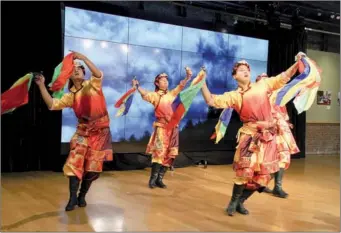  ?? HONG XIAO / CHINA DAILY ?? A song and dance show was presented by the Ethnic Song and Dance Ensemble, from the Aba Tibetan and Qiang autonomous prefecture in Sichuan province, during the opening event of the cultural program titled...