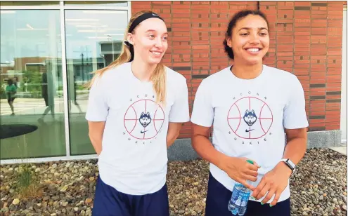  ?? Doug Bonjour / Hearst Connecticu­t Media ?? UConn sophomore Paige Bueckers, left, and freshman Azzi Fudd meet with media outside the Werth Champions Center on Tuesday in Storrs.