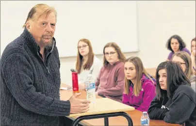  ?? MILLICENT MCKAY/JOURNAL PIONEER ?? Gwynne Dyer, left, freelance journalist and columnist, spoke to political studies and global issues classes at Three Oaks Senior High school recently to discuss the world in the Trump era and what the future could look like.